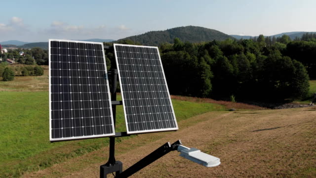 Green-power-generation-by-solar-panels.-Camera-slowly-rotating-around-solar-panels