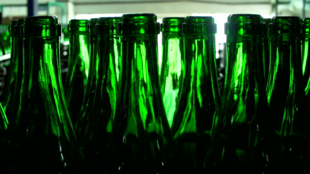 Champagne-bottles-on-factory-conveyor-belt