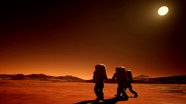 Tres-astronautas-en-trajes-espaciales-explorar-el-planeta-Marte