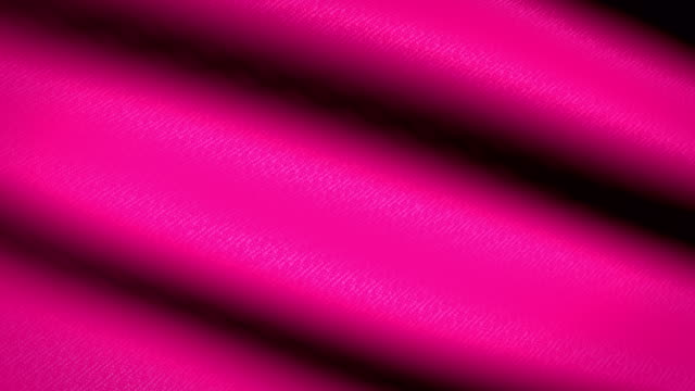 Rosa-Fahnenschwingen-Textile-strukturierten-Hintergrund.-Seamless-Loop-Animation.-Vollbild.-Slow-Motion.-4K-Video