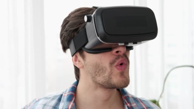 Man-enjoying-amazing-scene-in-virtual-reality-headset