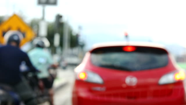 blur-front-view-scene-car-driving-traffic-jam-on-urban-road
