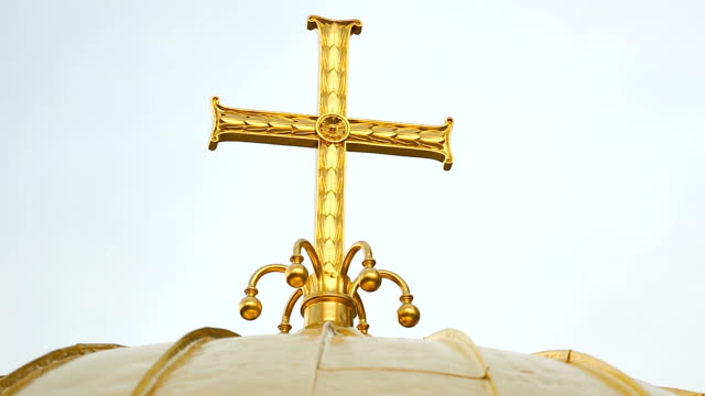 Christian-golden-cross-on-top-of-churches-dome,-religious-architecture,-worship