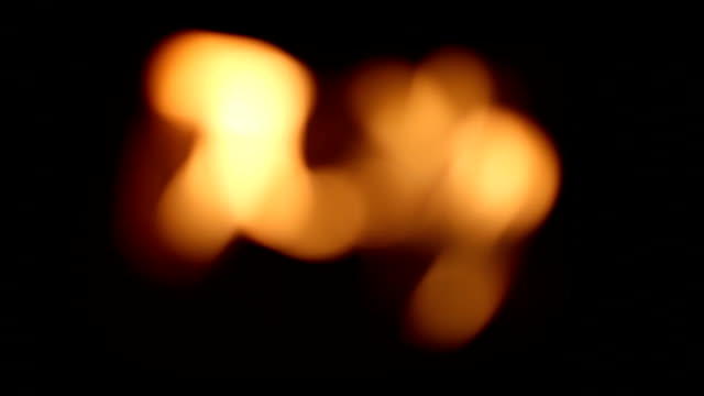 The-fire-in-the-fireplace-flame-at-black-background.-Out-of-focus-is-blurry.