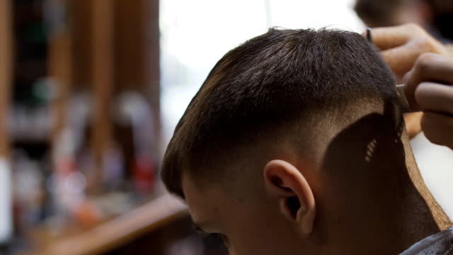 Process-of-cutting-hair-in-barbershop