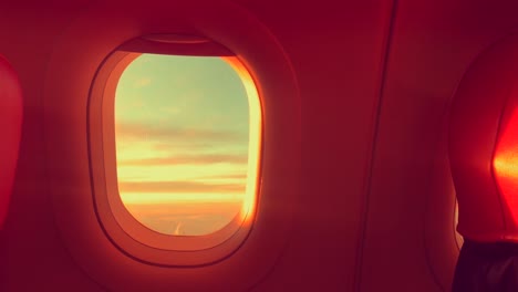 Cloud-Window-seat-airplane-concept.-Sky-cloud-view-from-Seat-airplane-close-up-window-on-sunset-beautiful.-It-sky-blue-or-azure-sky-and-cloud-over-land-in-daytime-beauty.