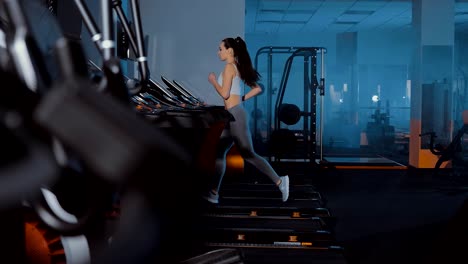 Athlete-runs-on-a-treadmill.-Sports-Hall