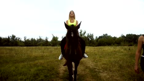Lovely-slim-girl-rides-on-horseback
