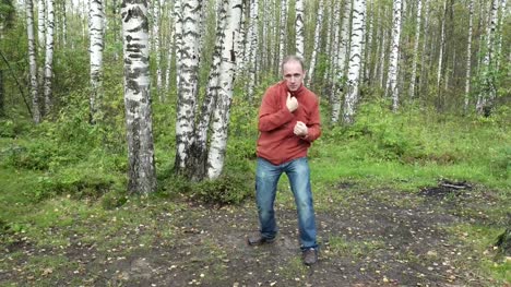 man-in-casual-clothes-does-fighting-martial-arts-on-a-forest-glade,slow-motion