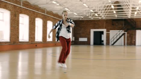 B-girl-dancing-breakdance-in-sport-gym