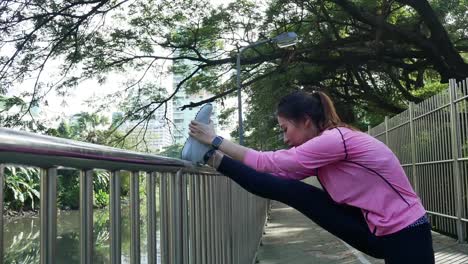 Fitness-sport-girl-fashion-sportswear-doing-yoga-fitness-exercise-in-street.-Fit-young-asian-woman-doing-training-workout-in-morning.-Young-happy-asian-woman-stretching-at-park-after-running-workout.