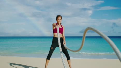 Woman-Exercising-with-Battle-Ropes