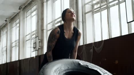 Determined-Woman-Flipping-Tire
