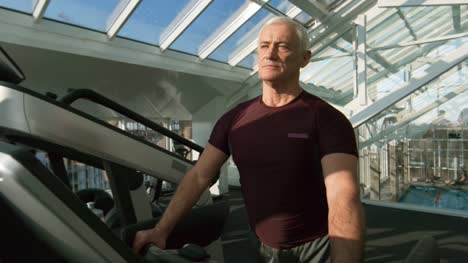 Grey-Haired-Man-Training-on-Treadmill