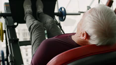 Elderly-Man-Doing-Exercise-on-Leg-Press-Machine