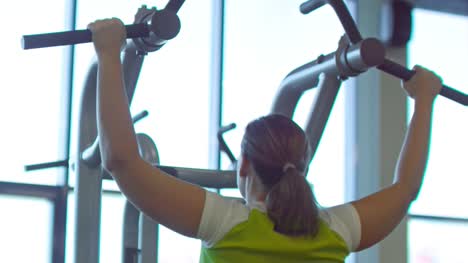 Woman-Doing-Pull-Ups-in-Gym