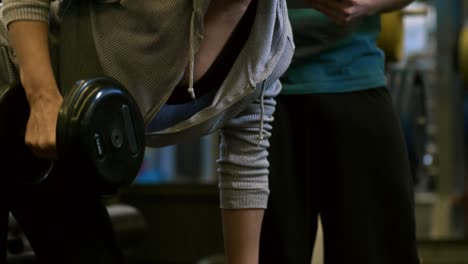 Fitness-Trainer-Monitoring-Progress-of-Woman