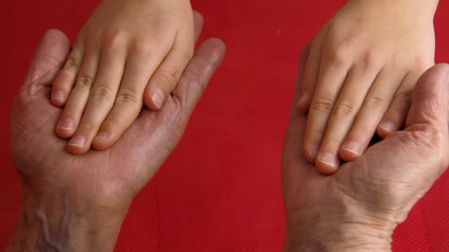 Old-and-young-hands.-Hands-of-an-elderly-person-and-a-child.