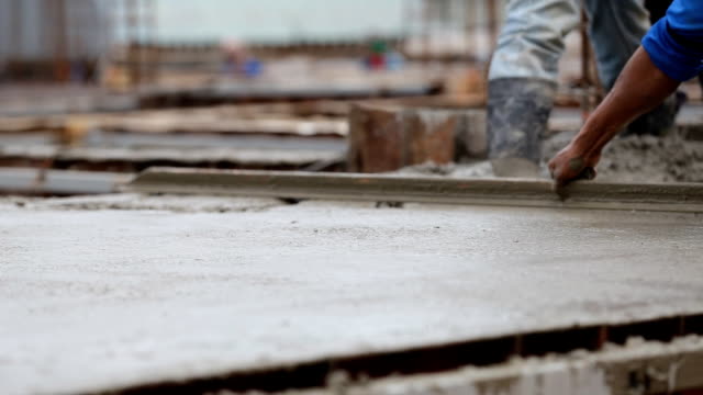 Industry-construction-men-workers-with-tool-concrete-mix-on-floor-construction