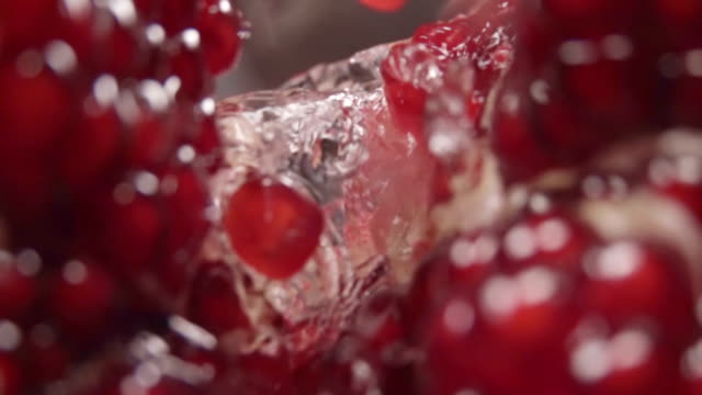 Water-flow-between-pomegranate-grains.-Slow-motion