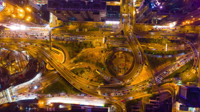 night-illuminated-traffic-road-junction-aerial-top-view-timelapse-4k-hong-kong