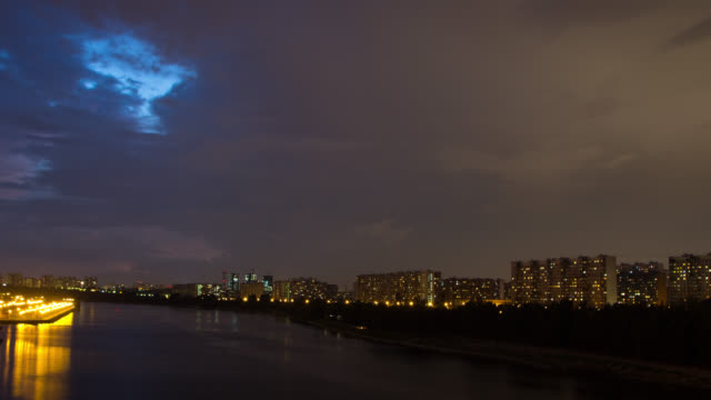 Thunderstorm-moves-over-apartments-buildings-at-night