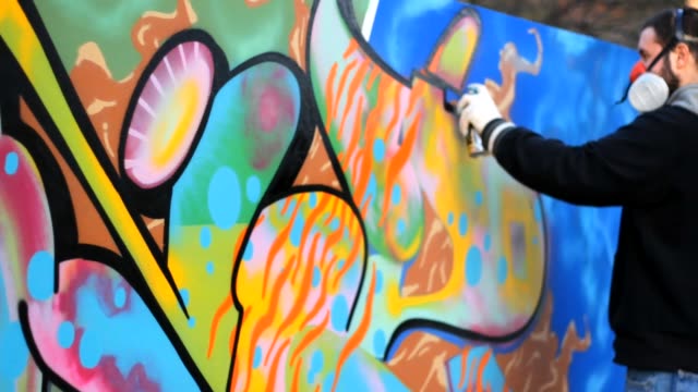 man-paint-Graffiti-on-the-wall