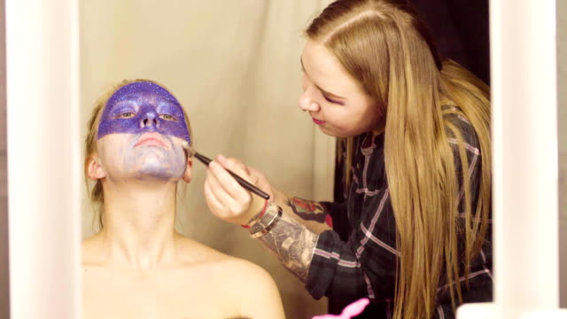 Face-art.-The-make-up-artist-applying-a-foundation