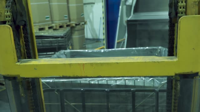 First-person-view-on-Forklift-truck-loading-a-truck.-Clip.-Forklift-Truck-Driver-unloading-Pallet-In-Storage-Warehouse.-Forklift-loader-load-boxes-into-a-truck