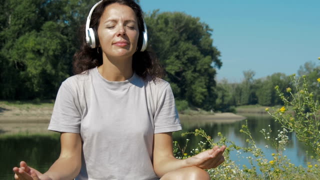 A-girl-is-meditating-in-nature.