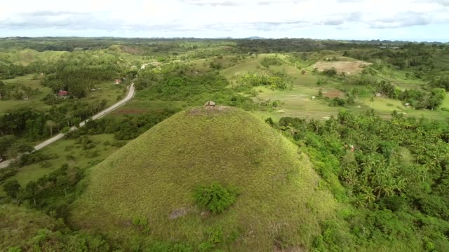 Aerial-view-of-house-on-the-top-of-Chocolate-Hills-Complex,-Batuan,-Philippines.