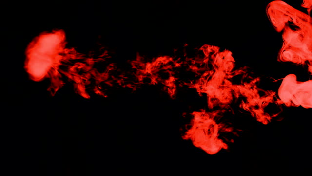 red-smoke-on-black-isolated-background