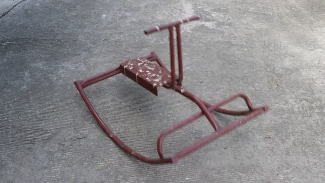 Steel-Rocking-Horse-Toys-rocking-on-the-concrete-floor.