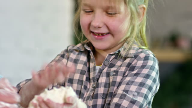 Hands-of-Little-Girl-Playing-with-Flour