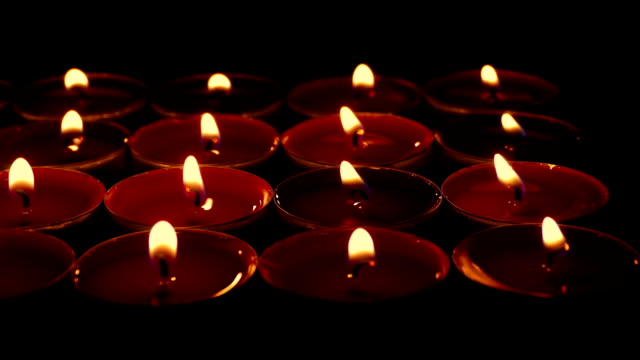 Passing-Red-Candles-On-Stand