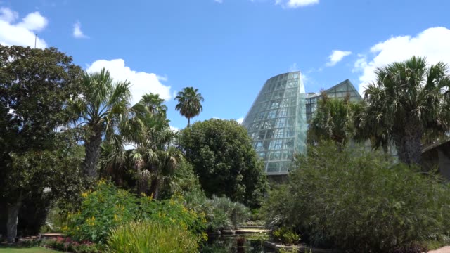Low-Angle-Video-of-Cone-Shape-Glass-Greenhouse-Walking-Towards-It