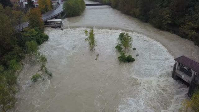 Drone-aerial-view-of-the-Serio-river-swollen-after-heavy-rains.-Province-of-Bergamo,-northern-Italy