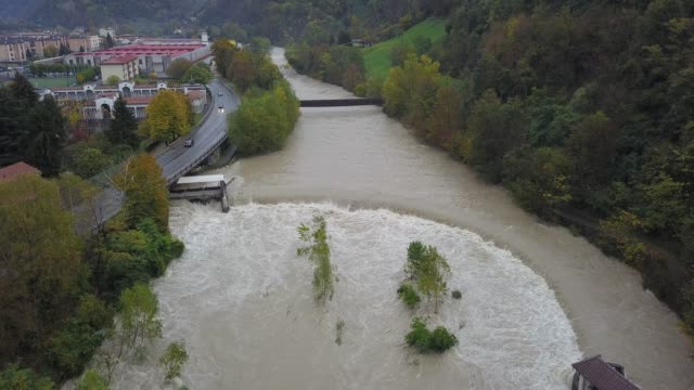 Drone-aerial-view-of-the-Serio-river-swollen-after-heavy-rains.-Province-of-Bergamo,-northern-Italy