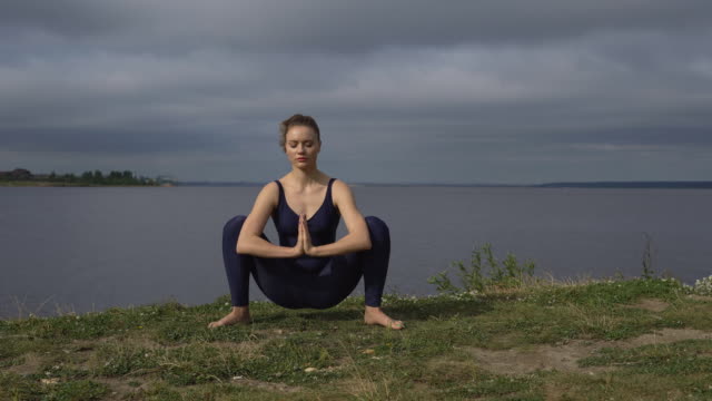 Woman-in-classical-yoga-pose,-energy-concentration