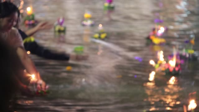 Time-lapse-blur-style-decorated-buoyant-floating-on-the-water-on-Loykratong-festival-at-Full-Moon-Day-of-the-Twelfth-Lunar-Month.