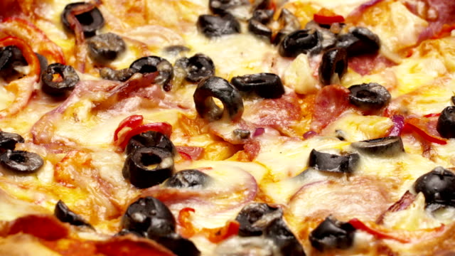 Rustic-italian-pizza-with-pepperoni,-mozzarella-and-olive