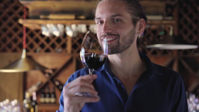 Man-Drinking-Red-Wine-From-Glass-At-Winery-Restaurant