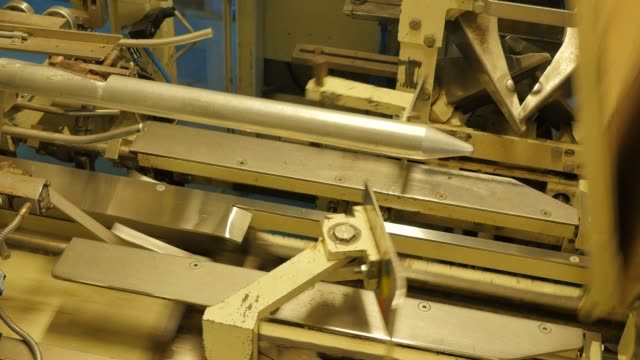 Folding-cardboard-boxes-on-a-conveyor-belt-in-a-rice-factory-–-4K