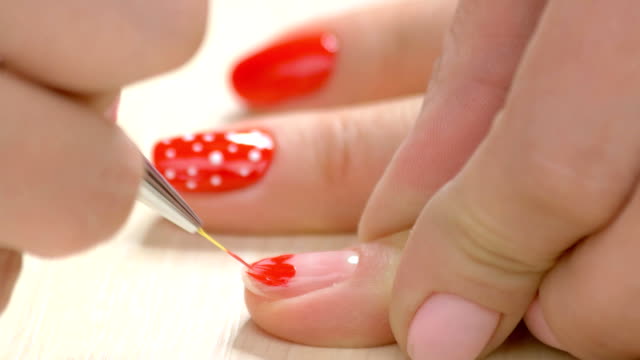 Nail-design-by-beautician-close-up.