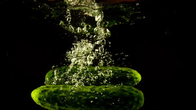 Falling-of-cucumber-in-water.-Slow-motion.