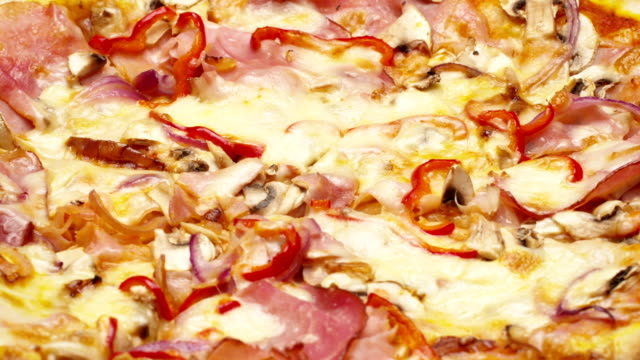 Rustic-italian-pizza-with-ham,-kaiser,-mozzarella-and-mushrooms