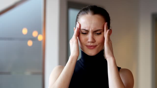 Headache,-Tense-Woman-in-Office
