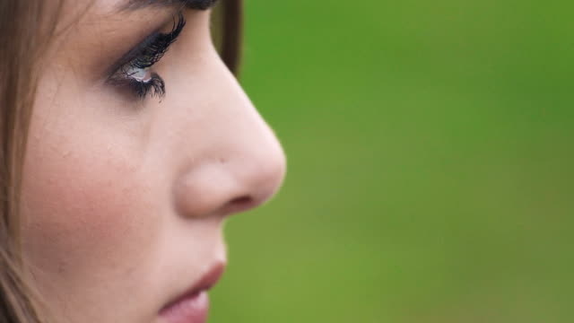 Profile-of-sad,-pensive-beautiful-young-woman,-close-up