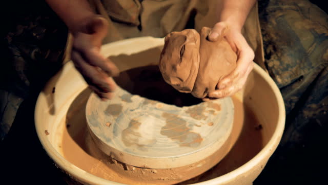 A-potter-brings-together-two-lumps-of-clay.