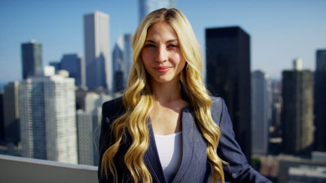 Portrait-of-Caucasian-female-consultant-on-Chicago-rooftop